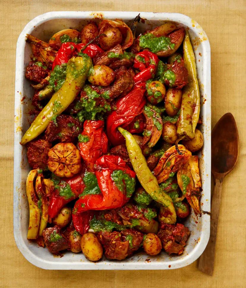 A dish of Baby Aubergines, Braised Greens and Lamb with peppers