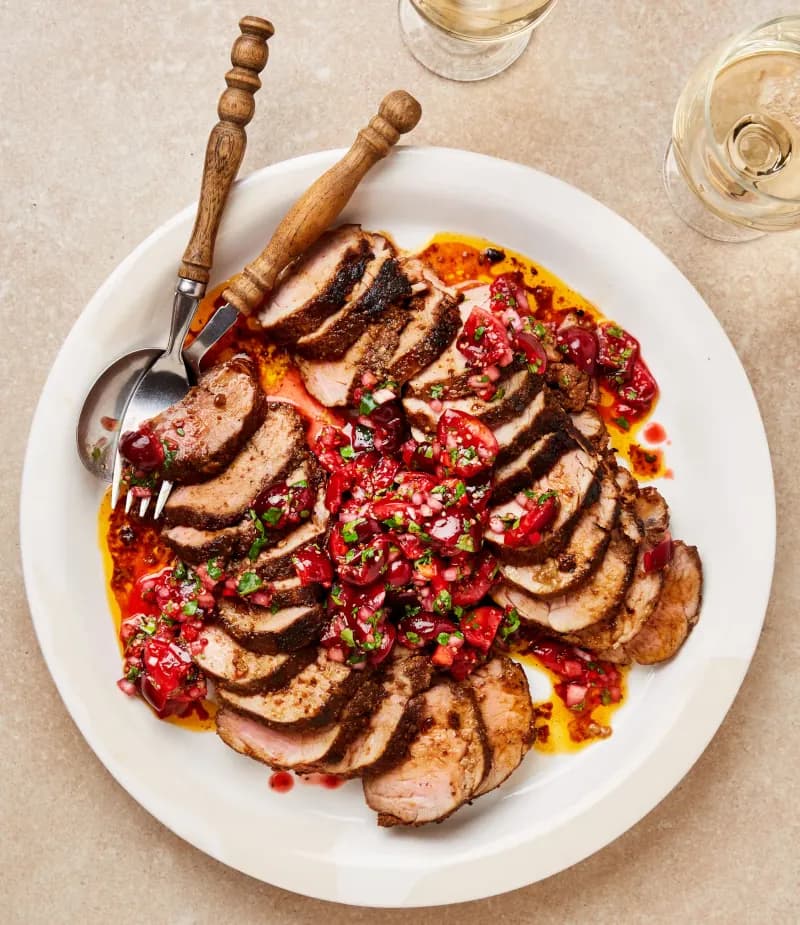 A dish of Roast Pork Tenderloin with Cherry and Chipotle Salsa