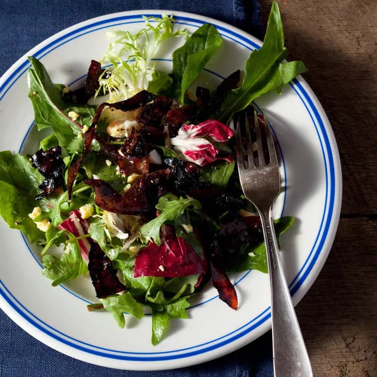 A dish of Salad With Balsamic-Glazed Prosciutto