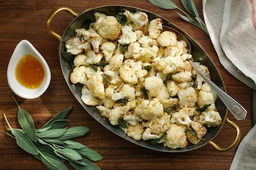 A dish of Cauliflower with Brown Butter, Pears, Sage & Hazelnuts